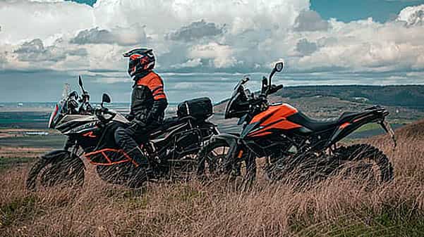 cape corporate tours ktm motorcycle rentals and tours offroad biker siting on ktm on mountain side second ktm parked